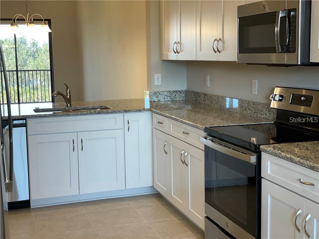 13823 MESSINA LOOP #203 — photo 4
