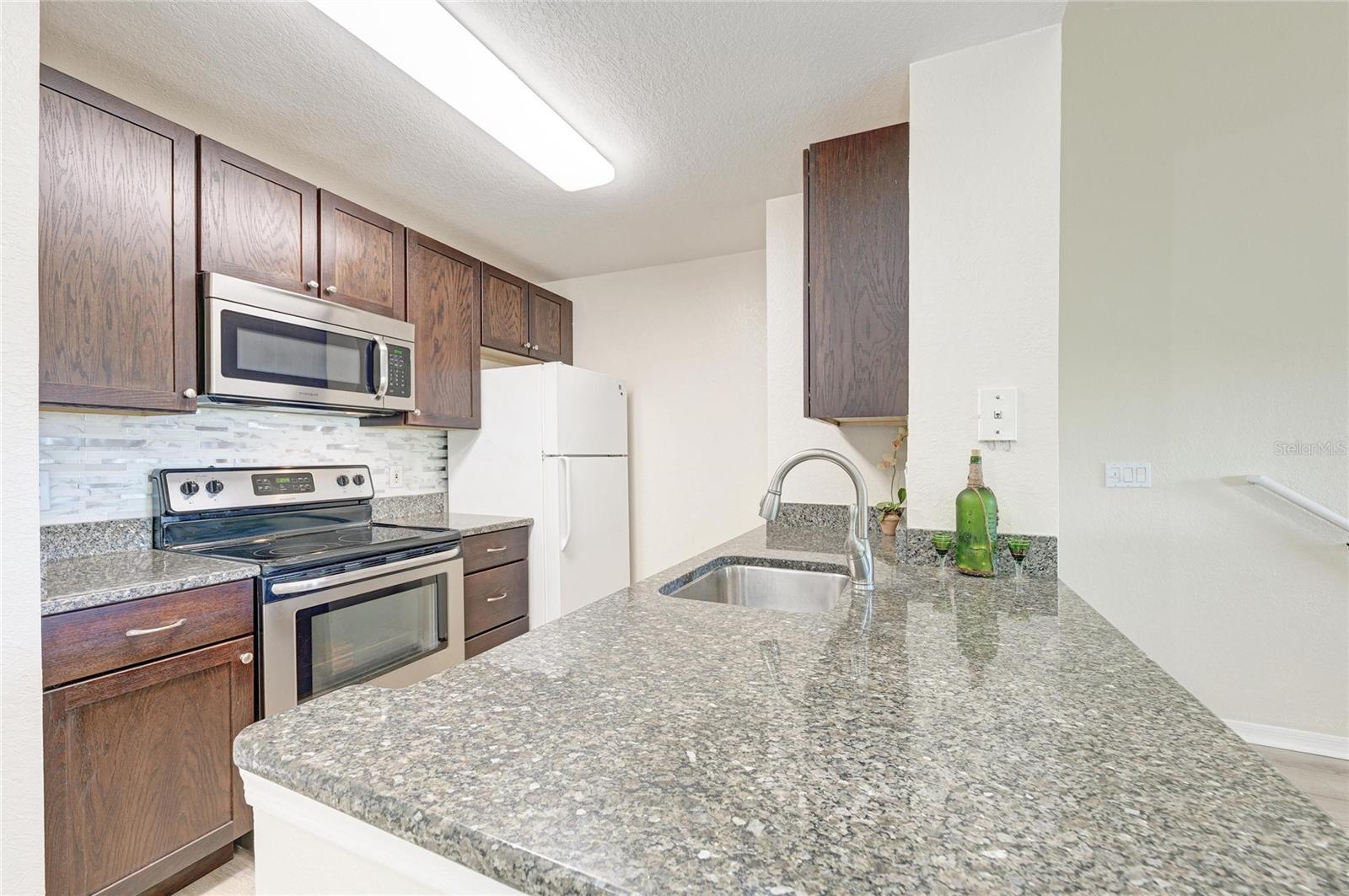 8911 MANOR LOOP #207 — photo 28