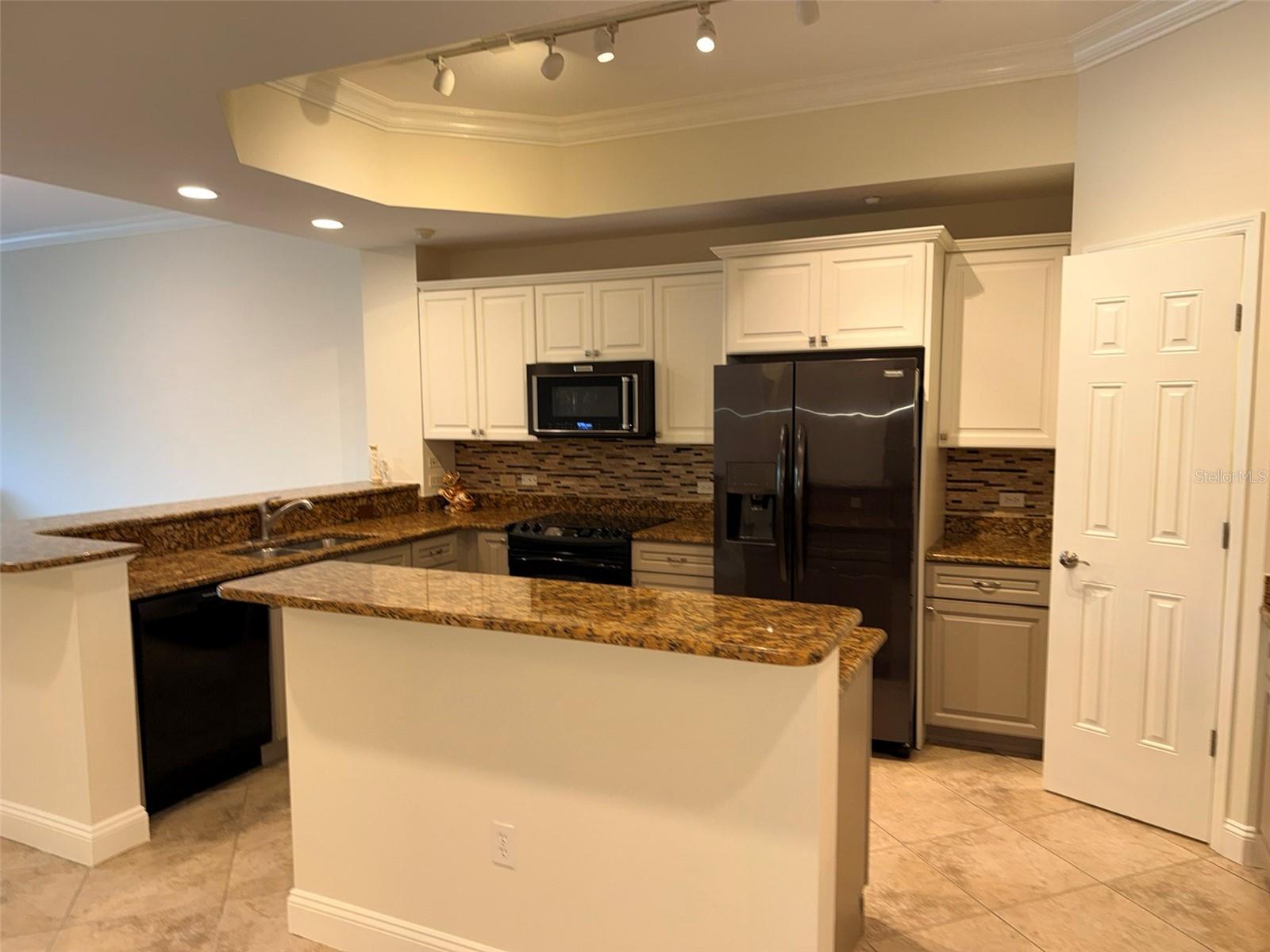 7702 LAKE VISTA CT #303 — photo 11